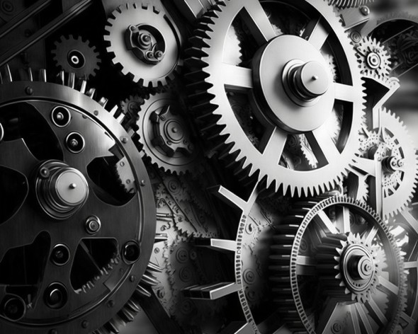 The internals of a technical device with cogs showing